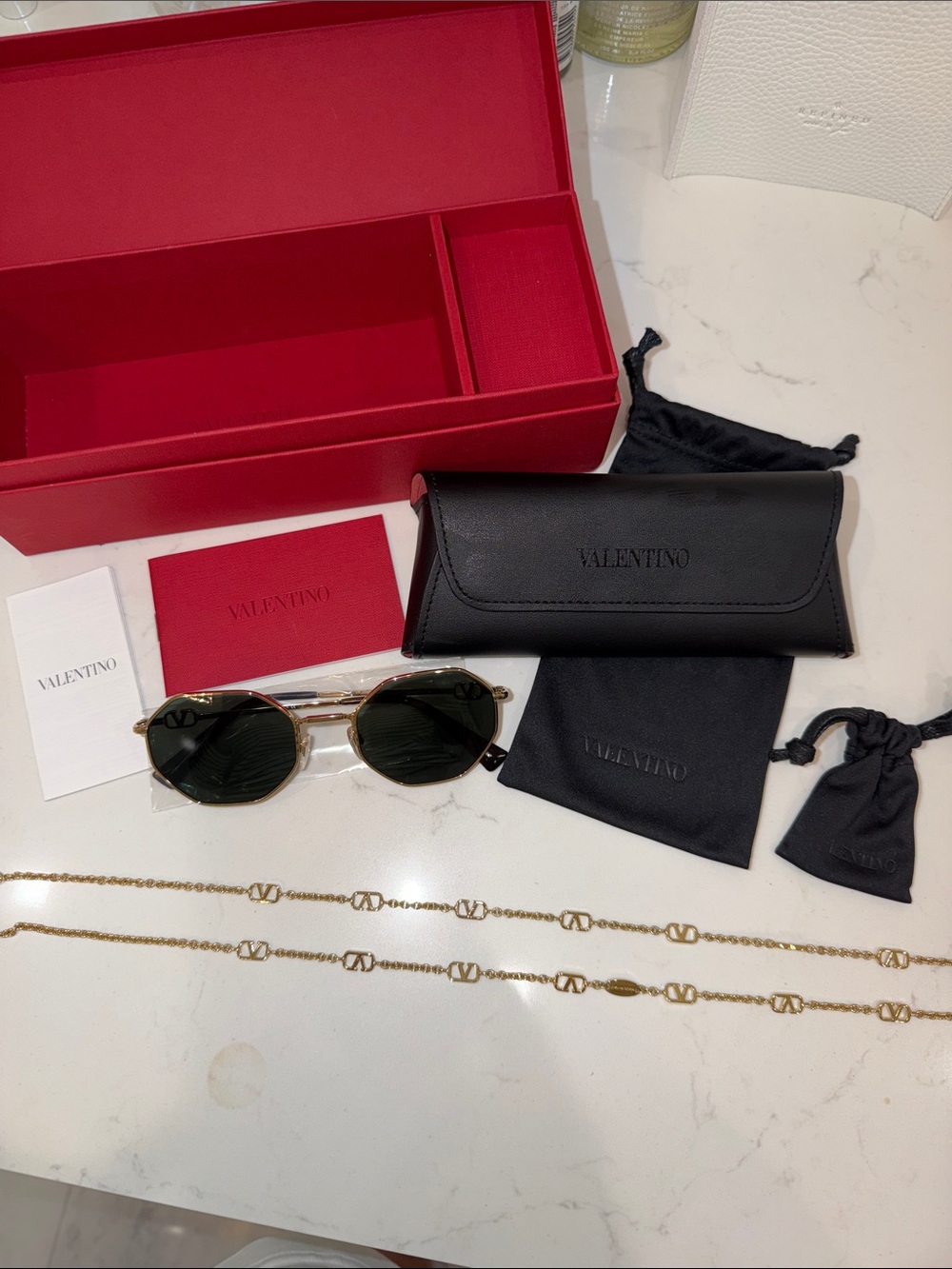 Valentino Gold-Trim Black Sunglasses with Gold Logo Chain
